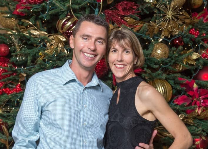 Robert (Left) and Krista (Right) Zivkovic together in front of a Christmas tree